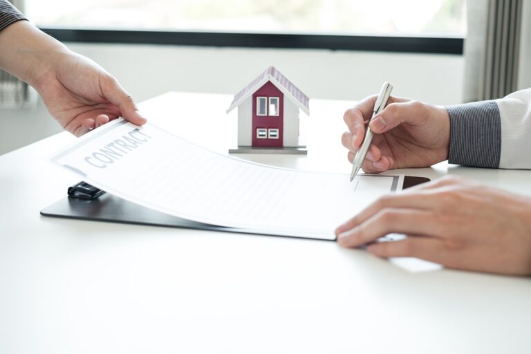 home seller reading the closing documents crafted by the real estate lawyer