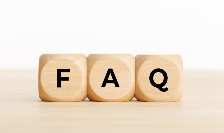 FAQ or frequently asked question concept. Wooden blocks with text on desk. Copy space