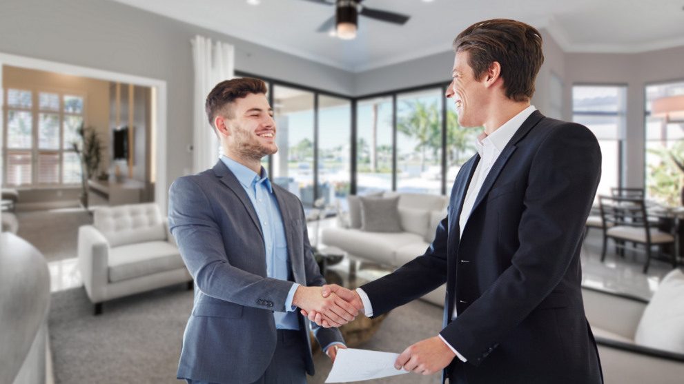 Real estate attorney shaking hands with the seller after closing, celebrating a signed contract following the three business day period, with county records updated, as both parties agree to protect their best interests.